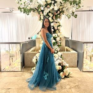 Elegant Blue Strapless Gown with Floral Details